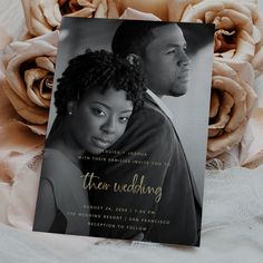 a wedding card with an image of a man and woman on it next to flowers