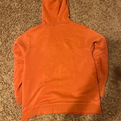 Orange Nike hoodie, super soft and has a Nike logo patch 
There are many “rips” but they are there for style, but some small stains 
YL Orange Nike Hoodie, Nike Hoodie, Nike Logo, Patch Logo, Unisex Hoodies, Nike, ? Logo, Orange