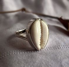 Cowrie Shell Ring, Handmade Ring, Natural Stone, 925 Silver Ring, Women Ring, Designer Ring, Thumb Ring, Gemstone Ring, Silver Jewelry All the jewelry made of 925 Sterling silver Handmade Jewelry We make the jewelry with lots of love 100% Quality Jewelry You will get well finished jewelry Shipping Details: We ship the order through Dhl, UPS shipping service which is track able. We accept the expedited shipping service. IF YOU HAVE ANY QUESTION PLEASE FEEL FREE TO ASK Gemstone Ring Silver, Alternative Jewelry, Shell Ring, Thumb Ring, Sterling Silver Jewelry Handmade, 925 Silver Ring, Cowrie Shell, Women Ring, Thumb Rings