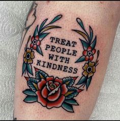 a close up of a person's leg with a tattoo on it that says treat people with kindness