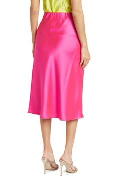 Elevate your wardrobe with this pull-on bias satin midi skirt for elegant, feminine style. 31" length (size S) Elasticized waist Pull-on style Satin construction 97% polyester, 3% spandex Machine wash cold, line dry Made in USA Model’s stats for sizing: 5’10” height, 34” bust, 27” waist, 35” hips. Model is wearing size S. Elegant Pink Satin Bottoms, Spring Pink Satin Bottoms, Pink Satin Evening Bottoms, Formal Pink Satin Bottoms, Pink Satin Skirt For Spring, Formal Pink Midi Skirt, Elegant Pink Satin Skirt, Pink Satin Lined Skirt Bottoms, Formal Pink Silk Skirt