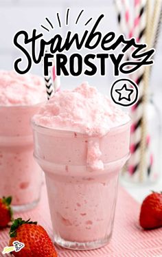 strawberry frosty in a glass with strawberries next to it