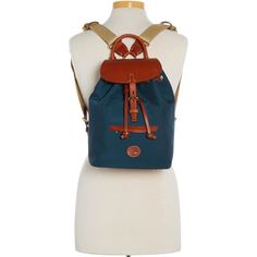 Durable and Chic  Crafted from durable-chic nylon that's virtually maintence-free, this backpack is ready for adventure wherever you go. Travel Backpack With Leather Trim And Nylon Material, Monogram Pendant, Tan Cowhide, Credit Card Wallet, Beach Getaways, Navy Fashion, Dooney And Bourke, Dooney & Bourke, Nylon Bag