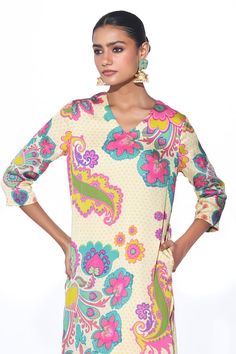 Cream kurta with multicolour floral and paisley printed motifs. Comes with matching pant. - Aza Fashions Vibrant Print V-neck Tunic, Festive Kalamkari Print V-neck Kurta, Summer V-neck Kurta With Printed Motifs, Bollywood Style V-neck Kurta With Printed Motifs, V-neck Kurta With Kalamkari Print For Navratri, V-neck Block Print Kurta For Navratri, V-neck Kalamkari Print Kurta For Navratri, Navratri V-neck Kurta With Kalamkari Print, Traditional V-neck Printed Kurta