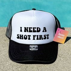 I need a shot first | Black and White Trucker Hat by Haute Sheet | Funny Alcohol related Hats TheFringeCultureCollective Trendy Trucker Hats, White Trucker Hat, Fun Hats, Funny Alcohol, Suede Fringe Vest, Alcohol Humor, Cropped Graphic Tees, Black Faux Fur Coat, Lightning Bolt Earrings