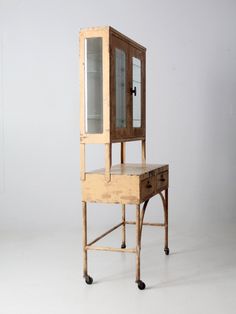 a wooden desk with a mirror on top