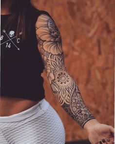 a woman with a tattoo on her arm