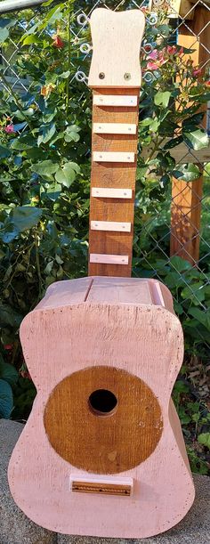 a wooden chair made to look like a guitar