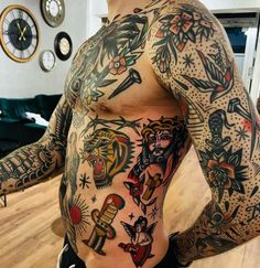 a man with lots of tattoos on his body