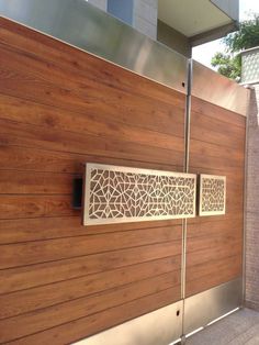 a close up of a wooden door with metal bars on the outside and wood panels on the inside