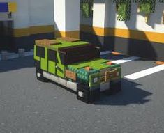 a truck made out of legos parked in a parking lot next to a building