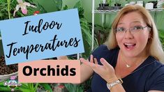 a woman holding up a sign that says indoor temperaturees orchids in front of her