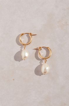 Keshi pearls dangling from high-shine hoops make a chic, modern accessory that goes with almost anything. 1 1/4" drop; 3/8" width Pearl size: 9mm Snap-post closure Due to natural variation, pearl shape and size may vary slightly 14k-gold fill/freshwater keshi pearl Made in the USA Playful Jewelry, Bridesmaid Pearl Earrings, Peacock Pearls, Gold Pearl Jewelry, Freshwater Pearl Jewelry, Simple Pearl, Fashion Scarves, Gold Pearl Earrings, Pearl Hoop Earrings