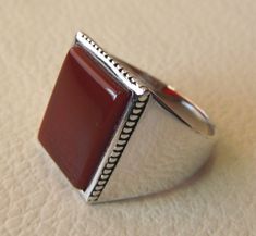 Rectangular silver aqeeq flat natural semi precious agate carnelian gemstone men ring sterling silver 925 jewelry all sizes fast shipping Risk free Quality guarantee policy : If you are not satisfied with your item for any reason simply send it to us and you will get a replacement or refund . please write or choose your size with the order and we will size it for you . Our ring is handcrafted mostly with a few simple tools . but some methods are used in casting like lost wax method . sterling si Elegant Silver Carnelian Signet Ring, Elegant Silver Signet Ring With Carnelian, Gemstone Wedding, Carnelian Ring, Men Ring, Men's Ring, 925 Jewelry, Ring Sterling Silver, Wedding Men