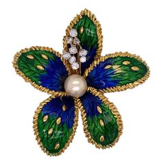 Boucheron Paris diamond enamel brooch crafted in 18 karat yellow gold. The floral brooch features 9 round brilliant cut diamonds weighing approximately .64 carat total weight and graded F-G color and VS clarity. The richly hued blue and green enamel is in great condition, and make the floral brooch come alive. Signed Boucheron Paris, numbered, and hallmarked. Diamond Butterfly, Floral Brooch, Enamel Brooch, Butterfly Brooch, Green Enamel, Flower Pins, Gold Floral, Jewelry Patterns, Round Brilliant Cut Diamond