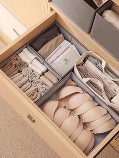 an open drawer filled with lots of clothes