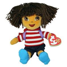 a small stuffed doll with long hair and blue pants, wearing a red and white striped shirt