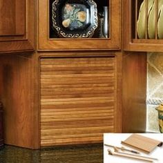 a wooden cabinet filled with dishes and utensils