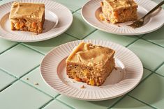 three plates with pieces of cake on them sitting on a green tile counter top next to a knife and fork