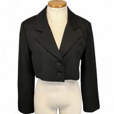 Condition: Fantastic Pre Owned, Smoke Free Home Label Size: Small Color: Black Material : Poly Blend This Cropped Blazer Has A Single-Breasted Silhouette, Lapel Collar And Shoulder Pads Taken From Traditional Tailoring. Hitting Just Above The Natural Waist, This Style Plays Well With High-Rise Jeans, Skirts, And Pants. Features: Cropped Length Notched Lapel Light Shoulder Pads Two Button Front Closure Fully Lined Split Seam Wrists Approx. Flat Measurements Shoulder: 16." Bust: 20" Sleeve: 22" Le Tailored Blazer Women, Hijab Makeup, Blazer Women, Tailored Blazer, High Rise Jeans, Lapel Collar, Blazers For Women, Suit Jackets