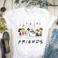 Friends Christmas Snoopy And Friends With Snowman T Shirt Design By Shitrless Fashion. With our wonderful selection of shirts, you may uplift your outfit. Our shirts, which are made of high-quality fabrics, provide unmatched comfort and timeless style. Our custom fit shirts are ideal for any setting and are made to enhance your appearance and self-confidence. Our shirts are the height of adaptability, whether you're dressing up for a formal occasion or choosing a more laid-back style. With our s Snoopy And Friends, Christmas Snoopy, Sopwith Camel, Friends Christmas, Snoopy Christmas, Friend Christmas, Laid Back Style, Unisex Shorts, Gift For Men