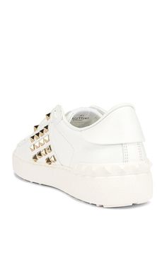 Goldtone pyramid studs add a flash of signature glamour to a lace-up sneaker that instantly elevates your street-style game.Lace up frontIncludes additonal white lacesPlatinum-fish studsSpecial label with the number 11 on tongueWhite rubber sole with rubber studs detail on the back.Composition: White leather (Calf)Rubber sole measures approximately 25mm/ 1 inchMade in Italy Casual White Sneakers With Studs, Casual White Sneakers With Spikes, Studded Streetwear Sneakers With Round Toe, Casual Low-top Sneakers With Studs, Casual Low-top Sneakers With Rivets, Studded Round Toe Sneakers For Streetwear, Casual White Studded Sneakers, Luxury Spiked Sneakers For Streetwear, White Spiked Round Toe Sneakers