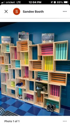 an image of a book shelf with books on it and shoes in the bottom row