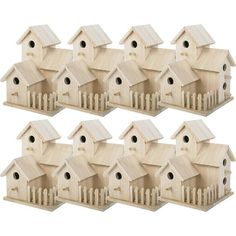 six wooden bird houses are lined up against each other