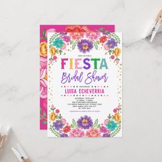 the fiesta bridal shower is on display next to some utensils and flowers