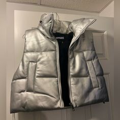 Brand New Apparis Shaun Silver Metallic Puffer Vest In Size L. Two Side Pocket And A Zip Out Hood In Collar. Beautiful And Chic! Cell Phone Holster, Phone Holster, Walker Boots, Fit N Flare Dress, Puffer Vest, Side Pocket, Rain And Snow Boots, Boot Sandals, Fit & Flare