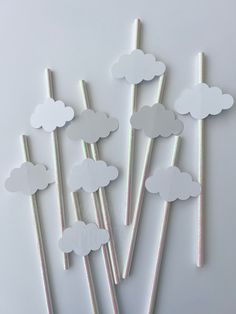 paper clouds are arranged on top of sticks