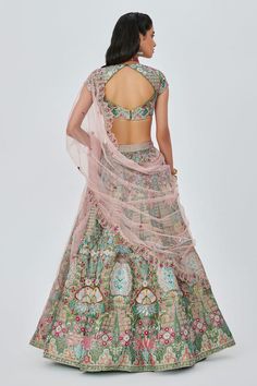 Multicoloured asparagus green attached cancan, 16 kali lehenga with heavy floral pattern appliques and embellishments. Comes with embellished padded blouse and contrast dupatta.
Components: 3
Pattern: Embellished
Type Of Work: Floral Appliques
Neckline: Square
Sleeve Type: Cap
Fabric: Tissue
Color: Green
Other Details: 
Lehenga:
Attached cancan
16 kalis
Length: 46 inches
Approx. weight: 5 kgs
Blouse:
Padded
Back cut-out
Closure: Back hooks
Dupatta:
Semi-sheer
Embroidered borders
Occasion: Bride, Kali Lehenga, Tissue Lehenga, Scallop Dupatta, Aisha Rao, Lehenga With Blouse, Panels Design, Blouse Yoke, Floral Applique, Bridal Designs