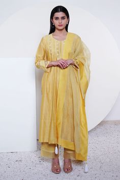 Yellow anarkali with floral embroidered motifs, organza panelled sleeves and bodice. Paired with organza panelled pant and striped, tassel dupatta.
Component: 3
Embroidered
Neckline: V neck
Sleeve Length: Three quarter
Fabric: Chanderi, Organza
Color: Yellow
Embroidered pant - Aza Fashions Organza Straight Kurta With Embroidered Border, Designer Organza Kurta With Embroidered Border, Traditional Organza Kurta With Embroidered Border, Diwali Organza Kurta With Embroidered Border, Organza Anarkali Set With Embroidered Border, Yellow Cotton Silk Churidar With Sheer Dupatta, Festive Organza Anarkali Set With Embroidered Border, Yellow Chanderi Anarkali Set With Embroidered Border, Diwali Tissue Silk Anarkali Set With Embroidered Border