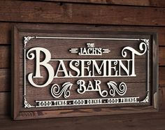 a wooden sign that says the jack's basement bar on top of a wall