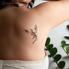 a woman with a tattoo on her back