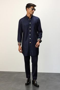 Navy blue jacket kurta featuring dori embroidery all over. Paired with a solid straight pant. - Aza Fashions Semi-formal Embroidered Unstitched Suit With Long Sleeve, Embroidered Unstitched Suit For Semi-formal Occasions, Semi-formal Long Sleeve Embroidered Unstitched Suit, Embroidered Semi-formal Traditional Wear For Diwali, Blue Semi-formal Traditional Wear With Long Sleeves, Blue Semi-formal Long-sleeve Traditional Wear, Designer Long Sleeve Kurta With Embroidered Cuffs, Eid Fitted Kurta With Embroidered Cuffs, Indigo Sets With Chikankari Embroidery And Long Sleeves