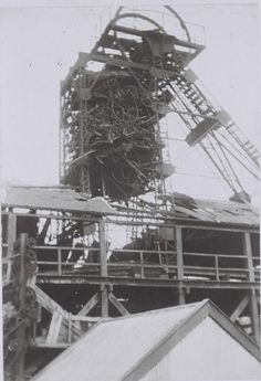 an old photo of a large structure that looks like it has been destroyed into pieces