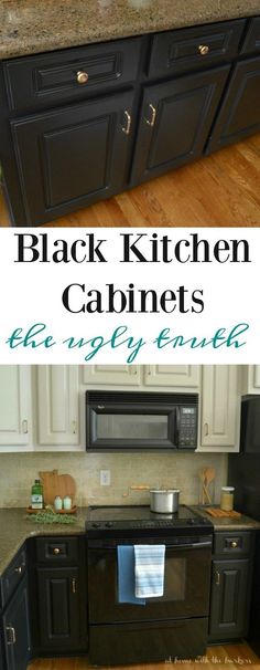 black kitchen cabinets with white walls and wood flooring in the middle, and an image of