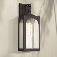 an outdoor wall light with two lights on it