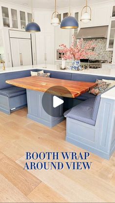 an image of a kitchen setting with blue cabinets and bench in the center, text boothwrap around view