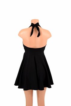 "This item is made to order, please read all the way through the listing before purchasing! This flowy dress is made of super comfy black soft knit stretch fabric. The halter top is darted and ties behind the neck, the hemline is circle cut. Length: 17\" measured from the waist to the hemline. We can create this dress from any other fabric in our shop, just ask! Womens Sizing (See below for instructions on where measurements should be taken) XXS: Bust 29\"-30\" / Waist 22\"-23\" / Hips 30\"-32\" Black Mini Length Halter Top For Party, Black Mini Halter Top For Parties, Black Stretch Halter Dress Backless, Black Stretch Halter Backless Dress, Black Stretch Backless Halter Dress, Black High Neck Halter Top For Night Out, Casual Black Halter Backless Dress, Casual Black Backless Halter Dress, Casual Black Halter Neck Dress