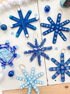 paper snowflakes and ornaments on a table