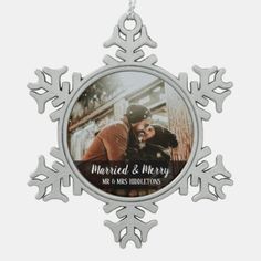 a snowflake ornament with an image of a man and woman kissing