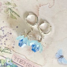 Aquamarine Flower Earrings, Birthday Gift For Best Friend, Sapphire Fairy Flower Earrings, Sky Blue Drop Earrings, Pale Blue Fairy Earrings These elegant aquamarine flower Earrings are inspired by the enchanting flowers in my garden, they have been made using pretty pale blue lucite flowers. They have matching coloured crystals in aquamarine, these crystals are so sparkly when they move. Finished with silver 925 huggie hoop ear wires and ornate floral bead caps. They are very light weight and are perfect for special occasions, thank you gifts, birthday gifts, anniversaries and yet cute enough for everyday wear.  Please note colours may vary slightly on different monitors.  ▪️ One of a kind, only one made. ▪️ lightweight and comfortable. ▪️ This item is ready for posting. ▪️ Lead and Nickel Blue Dangle Earrings For Birthday, Blue Fairy Jewelry For Party, Blue Earrings For Pierced Ears, Birthday, Whimsical Blue Flower Earrings For Gift, Blue Fairy-style Jewelry For Party, Delicate Blue Flower Earrings, Whimsical Blue Dangle Flower Earrings, Delicate Blue Flower Shaped Earrings, Adjustable Nickel-free Blue Flower Earrings