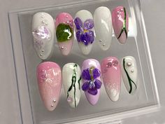 Experience the Serenity of Nature with Our Pale Pink and White Floral Press On Nails! 🌸💅 Indulge in the timeless beauty of our exquisite press-on nails, where delicate details meet nature-inspired charm. 🌿✨  🌸Ethereal Blooms Elegance: Dive into the world of sophistication with our press-on nails, featuring a delicate blend of soft pink and pristine white hues. Each nail is adorned with meticulously crafted purple flowers, bringing forth an essence of grace and refinement.✨ 💖3D Floral Finesse: Experience the pinnacle of nail artistry with our 3D floral design, showcasing intricately drawn green leaves that add a vibrant and nature-inspired flair. The raised texture of the leaves creates a standout effect, bringing you closer to the beauty of the outdoors.💜 🌟Nature's Embrace: Immerse White Press On Nails, Nails 3d, Nails Today, Nails Fake, Nails Spring, Manicure Y Pedicure, Cute Nail Designs, 3d Nails, False Nails