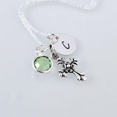 This Beautiful Sterling Silver charm necklace features a small, 18mm x 7mm ornate cross charm, personalized with a hand-stamped Initial letter disc, and crystal dangling birthstone charm. Charms hang from a well-made Sterling Silver 0.8mm Cable or Box Chain.  The necklace arrives beautifully packaged ready for gift-giving.  SHOP Forever Memory Designs: http://www.etsy.com/shop/ForeverMemoryDesigns Personalized Cross Charm Necklace For Gift, Personalized Spiritual Cross Charm Necklace, Spiritual Personalized Cross Charm Necklace, Personalized Sterling Silver Cross Charm Necklace, Engraved Cross Charm Necklace As Gift, Engraved Cross Charm Necklace Gift, Engraved Cross Charm Necklace For Gift, Personalized Silver Cross Charm Necklace, Memory Design