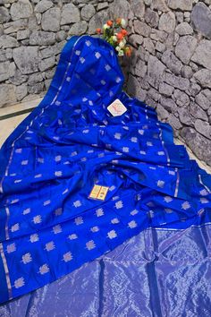 Shop a different appearance for your next party; the only leisurely fabric of chanderi banarasi silk in blue color with unparalleled silver zari lotus buti work on the body, with traditional kadhua weaving on the pallu and the border making this saree one of the unique variety. Color: A shade of blue color Technique: Amazing work of silver zari buti on the body with traditional weaving on the rest of the saree Fabric: Chanderi Silk Quality: Indyvogue's Assurance of Pure Silk Mark Certified Saree Blue Cotton Silk Kurta For Festivals, Designer Blue Katan Silk Saree, Designer Blue Saree With Traditional Patterns, Blue Raw Silk Saree For Eid, Royal Blue Silk Traditional Wear With Zari Work, Blue Silk Traditional Saree, Blue Chanderi Traditional Wear For Navratri, Blue Silk Saree For Diwali, Designer Blue Silk Traditional Wear