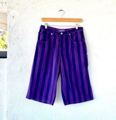 The best early hip hop long denim shorts in the coolest color combo!! Very iconic and in perfect condition! S p e c i f i c s . . . Label: Guess by Georges Marciano Tagged Size: 20 (this is probably not American size) Approx Fit: Mens >> XS - S Color: Purple // Black // White Material: Denim // Zipper Fly Condition: Overall in Amazing Vintage Condition Retro Blue Jean Shorts For Streetwear, 90s Relaxed Fit Streetwear Shorts, 90s Relaxed Fit Shorts For Streetwear, Relaxed Fit 90s Shorts For Streetwear, 90s Style Short Length Jeans For Streetwear, Purple Denim Bottoms For Streetwear, 90s Cotton Shorts For Streetwear, 90s Style Cotton Shorts For Streetwear, 90s Blue Jean Shorts For Streetwear