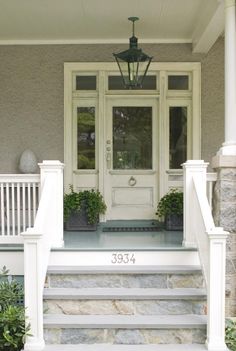 a front porch with steps leading up to the door