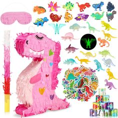 a pink dinosaur pinata decorationating kit with lots of stickers and confetti